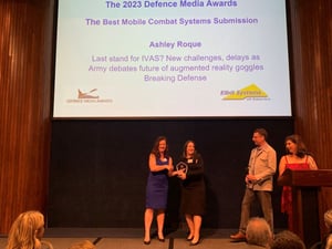 Elbit America's Melissa Hobbs-Hendrickson presents Ashley Roque with a 2023 Defence Media Award.